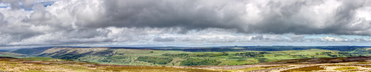 Obraz premium Panorama of cloudy sky and the hills of the Yorkshire Dales, United Kingdom 