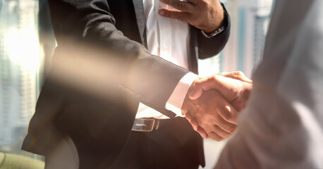 businessman handshake for teamwork of business merger and acquisition