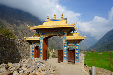 Decorated entrance gate to a monastery in Nepal along the Manaslu Circuit trek