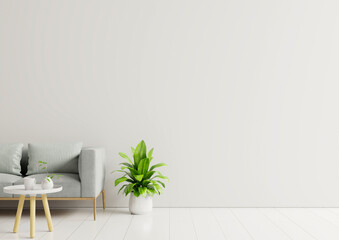 Empty living room with sofa, plants and table on empty white wall background.