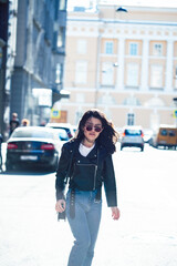 Obraz premium young pretty asian girl outside on big city street, lifestyle people concept