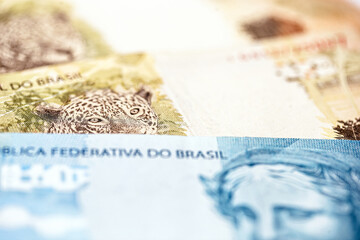 Brazilian money, macro and close up of 100 and 50 reais bank notes. Brazilian economy concept.