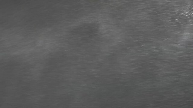 Snow storm at night, blizzard blows outside of house