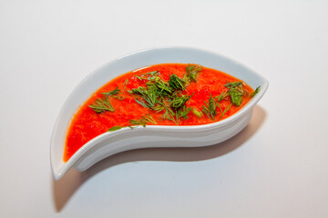 Red sause  in a white bowl