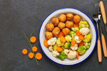 Meatballs with broccoli and a cauliflower