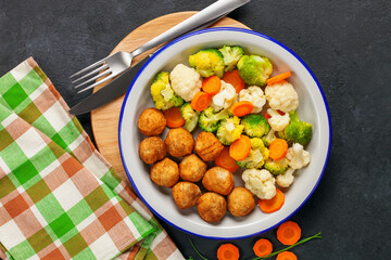 Meatballs with broccoli and a cauliflower