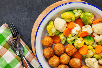 Meatballs with broccoli and a cauliflower