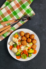 Meatballs with broccoli and a cauliflower