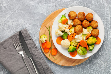 Meatballs with broccoli and a cauliflower