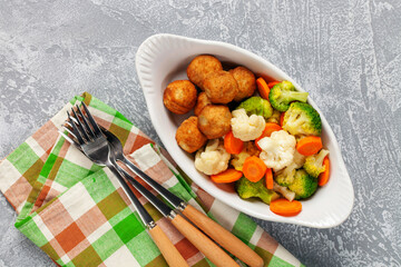 Meatballs with broccoli and a cauliflower