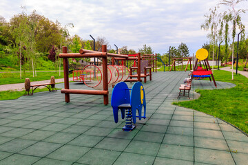 Fototapeta na wymiar Empty colorful children's playground in a city park