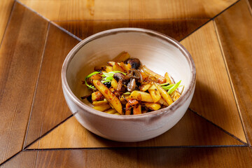 Fried potatoes, side dish, on a plate, lunch at home or in a cafe, isolate