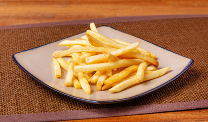 French fries, fast food in a cafe or at home