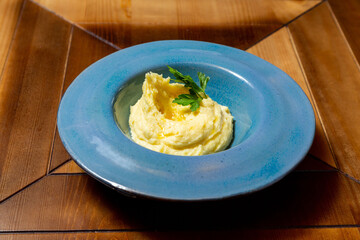 Mashed potatoes, side dish, in a plate, lunch at home or in a cafe
