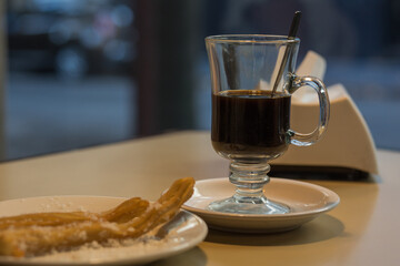 cup of coffee in bar with background