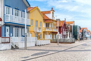 Street with colorful striped houses, Costa Nova, Aveiro, Portugal. Facades of colorful fisheman houses in Costa Nova, Aveiro, Portugal