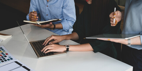 Top view image of graphic designing team working together and brainstorming about new feature on...