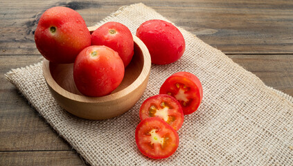 fresh tomato on wood background
