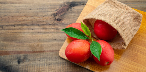 fresh tomato on wood background
