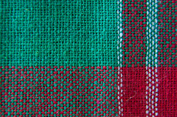 Green and red pattern with white of clothes macro