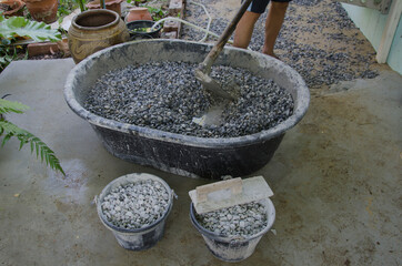 Manual concrete mixing in mortar pan
