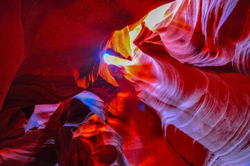 Beautiful view of amazing sandstone formations in famous Antelope Canyon on a sunny day with blue...