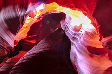 Beautiful view of amazing sandstone formations in famous Antelope Canyon on a sunny day with blue...