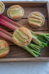 home made almond rhubarb muffins on a table