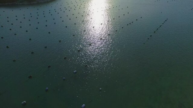 Aerial tilt up shot of beautiful sea against sky on sunny day - Ston, Croatia
