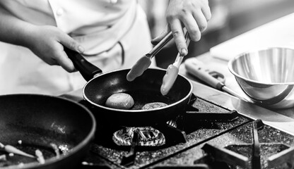Chef cooking in a kitchen, chef at work, Black & White.