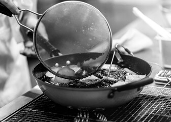 Chef cooking in a kitchen, chef at work, Black & White.