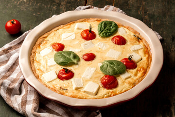 Vegetarian spinach tart with feta on wooden table. greek spinach pie