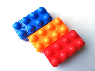 Top view on multi color toy bricks isolated on white  background