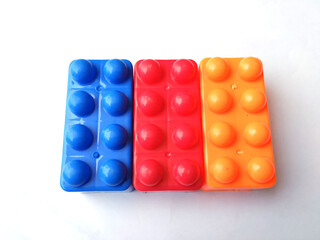 Top view on multi color toy bricks isolated on white  background