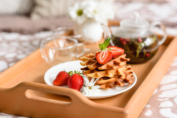 Delicious fresh baked belgian waffles with berries and fruit