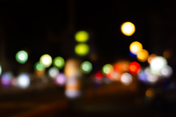 Blurred city street lights at night.
