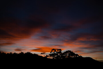 sunset sky with beautiful pink clouds over the hills of Tasmania