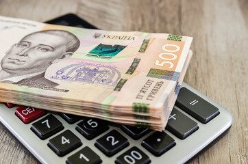 stack with 500 hryvnias on a calculator. Business concept.