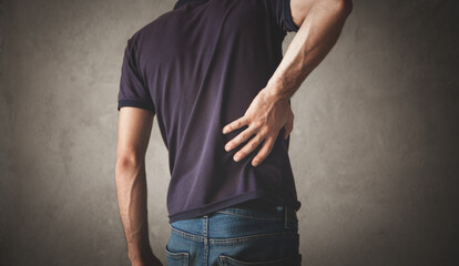 Caucasian man suffering from back pain.