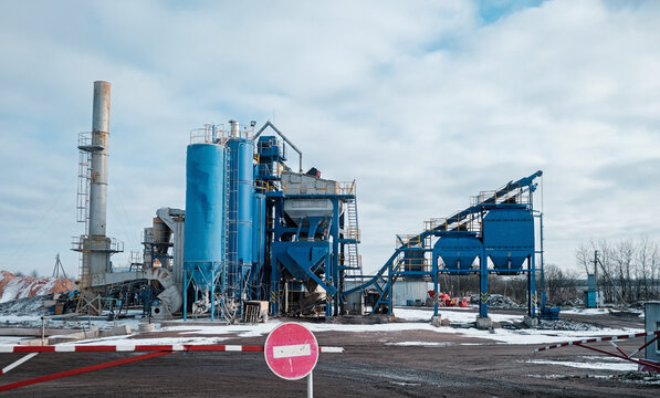 Storage and drying of grains, wheat, corn, soy, sunflower against the blue sky with rice fields