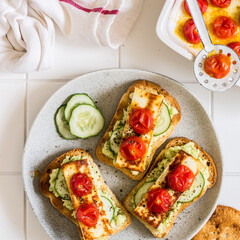 Avocado, Fried Cheese, Cucumber and Tomato Toasts