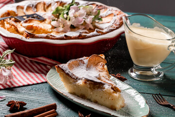 apple tart with caramel, a piece of cake, top view on a wooden board. banner menu recipe place for text. top view
