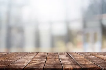 Möbelaufkleber Leere Holztischplatte und verschwommenes Glasfenster im Restaurant-Banner-Mock-up-abstrakten Hintergrund - kann zur Anzeige oder Montage Ihrer Produkte verwendet werden. © bunditinay