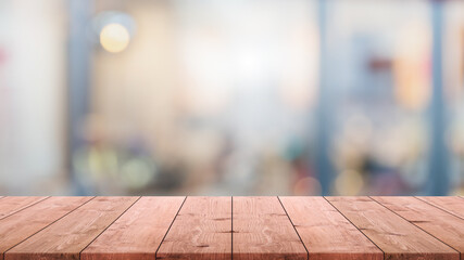 Empty wood table top and blur glass window interior restaurant banner mock up abstract background -...