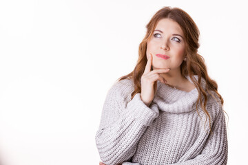 Confused young woman in sweater