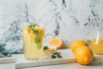 Composition with fresh lemonade on table
