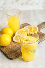 Composition with fresh lemonade on table