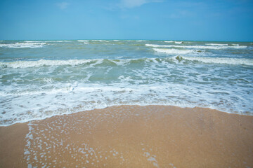 Tropical sea,Beach with Summer time. Close-up photo of beautiful beach with crystal clear turquoise water . Green and sky sea and the waves . Summer vacation background.