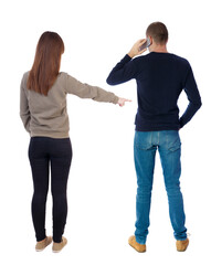 Back view of couple in sweater with mobile phone.