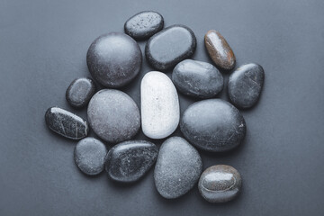 Fototapeta na wymiar Stones on grey background. Unity concept